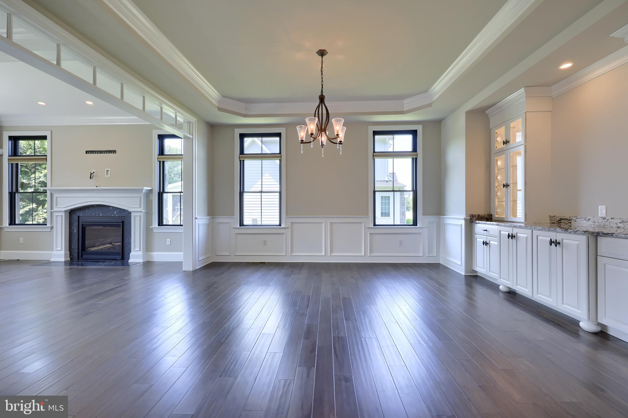 428 Southampton Drive Lititz, PA 17543 - Photo 18 of 60 an empty room with wooden floor fireplace and windows