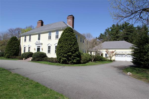 1 Channing Road Dedham, MA 02026 - Photo 2 of 22 a front view of a house with a yard and garage