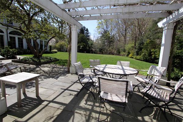 1 Channing Road Dedham, MA 02026 - Photo 6 of 22 a view of a patio with table and chairs and potted plants