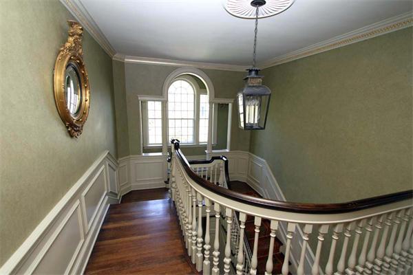 1 Channing Road Dedham, MA 02026 - Photo 8 of 22 a view of a hallway with wooden floor and windows