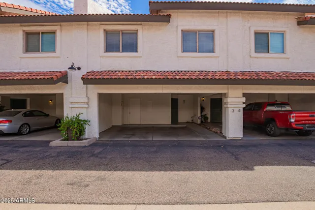 a view of a car park front of house