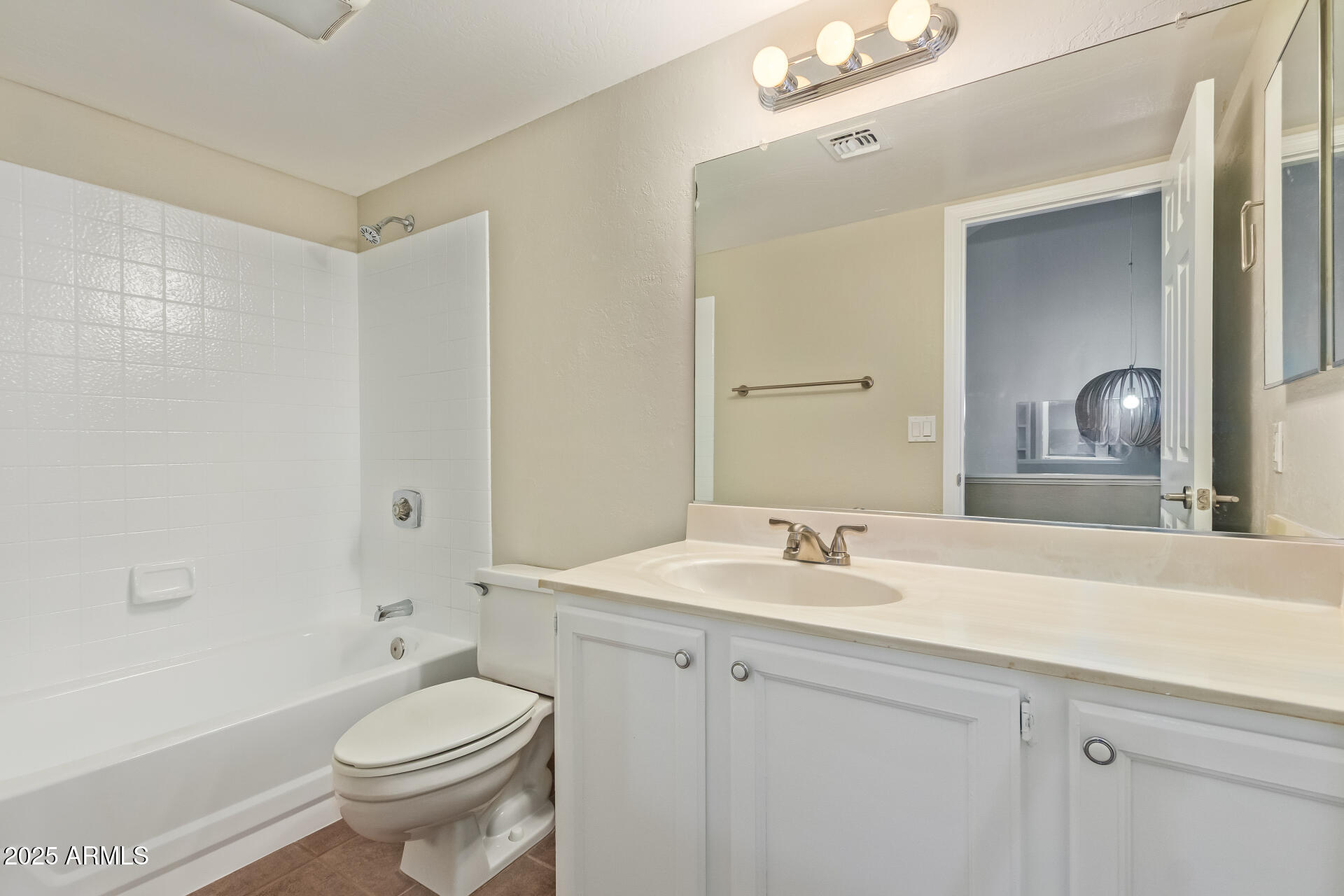 4328 North 36th Street, Unit 3 Phoenix, AZ 85018 - Photo 11 of 15 a bathroom with a sink a toilet and shower