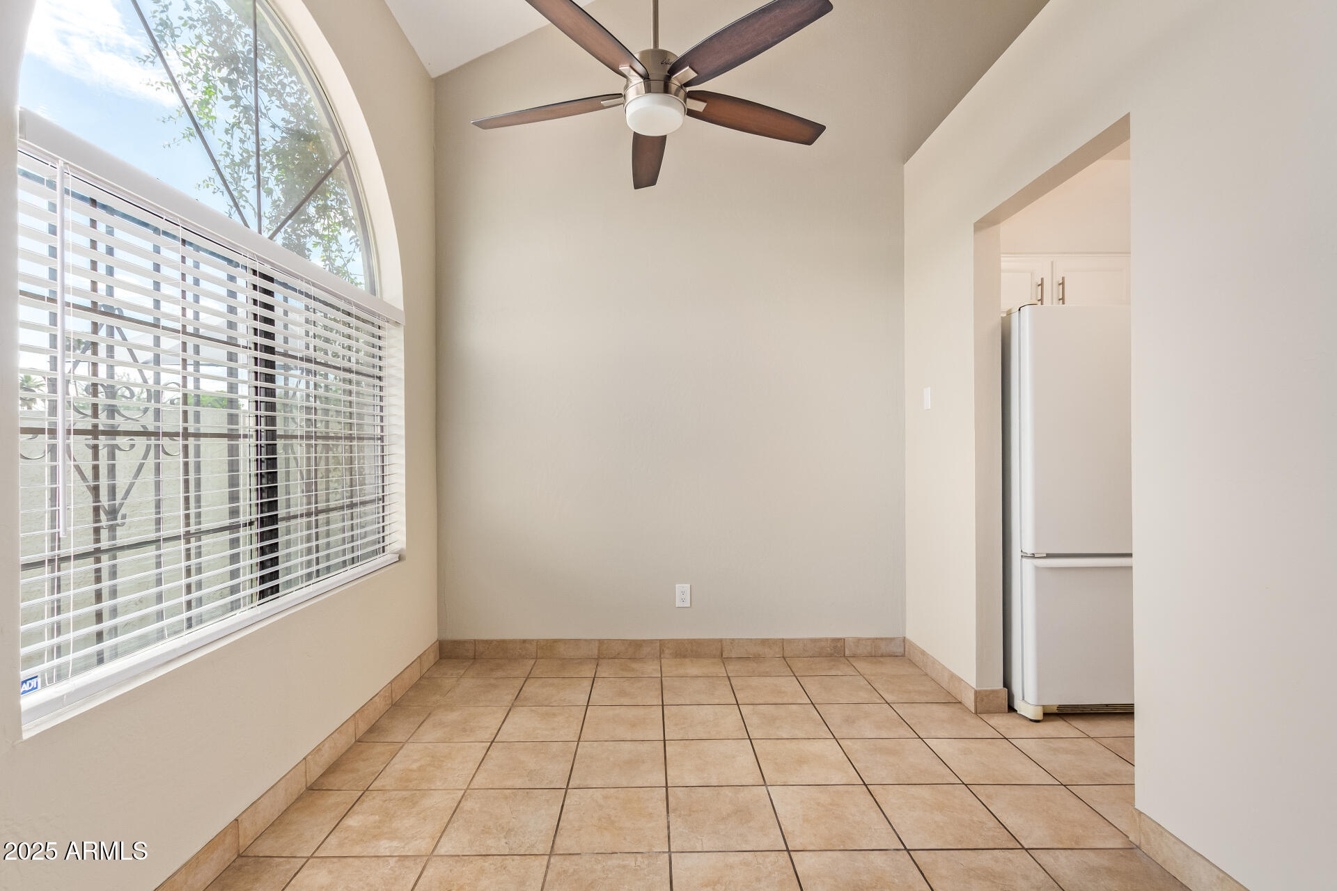 4328 North 36th Street, Unit 3 Phoenix, AZ 85018 - Photo 12 of 15 a view of a livingroom with an empty space and a window