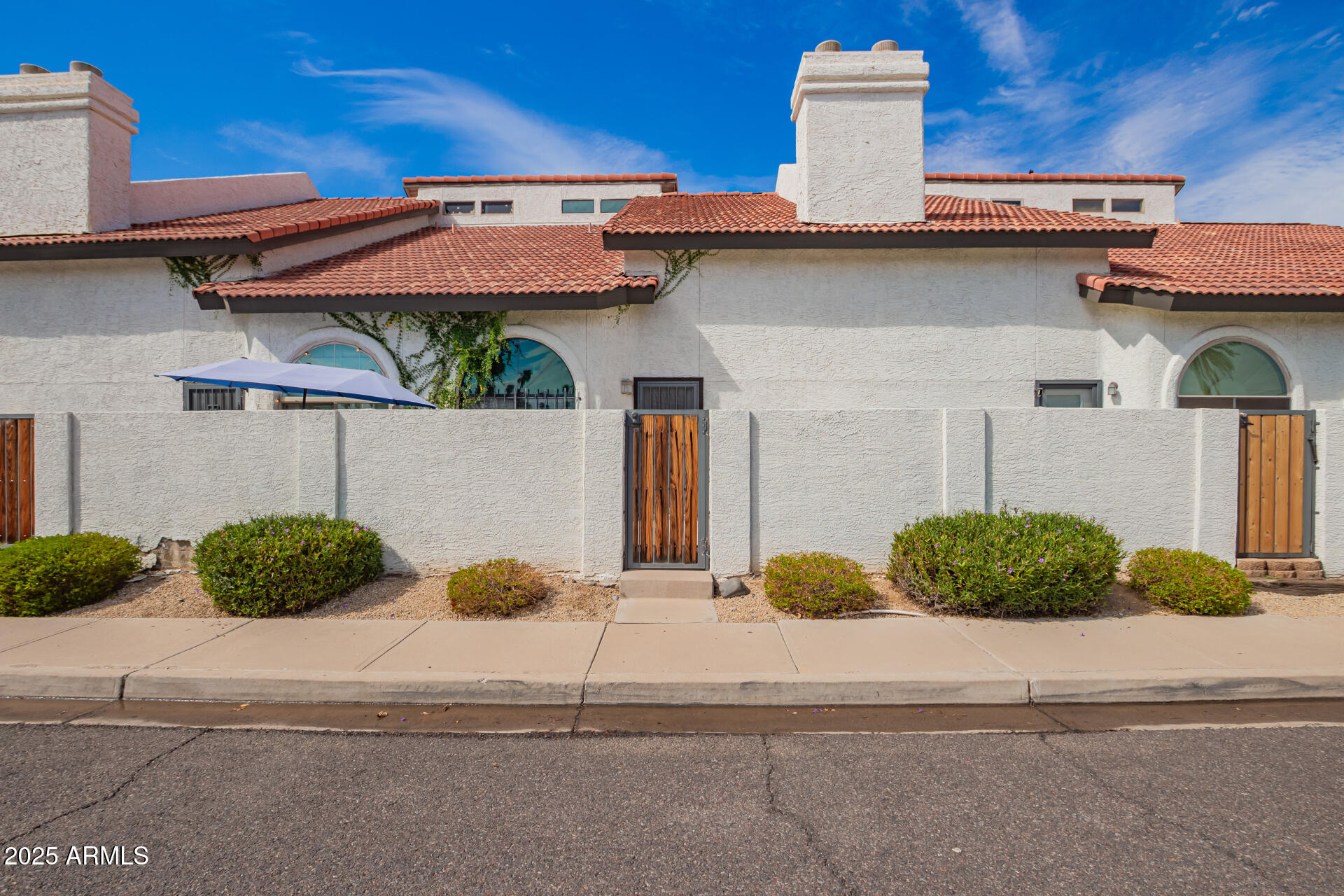 4328 North 36th Street, Unit 3 Phoenix, AZ 85018 - Photo 14 of 15 a front view of a house with garage