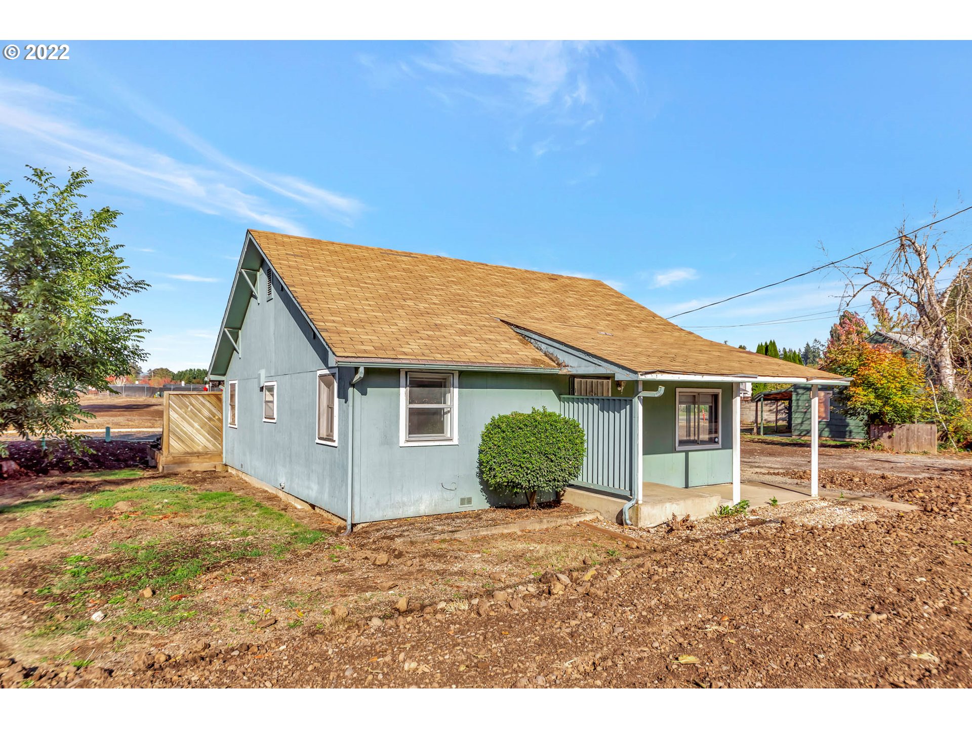 4361 Kalmia Street Springfield, OR 97478 - Photo 2 of 12 a view of a yard in front of a house with a large tree