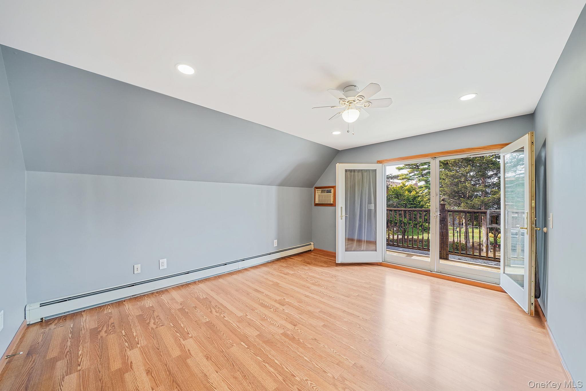 26 Bokel Road Ronkonkoma, NY 11779 - Photo 16 of 34 a view of an empty room with a window