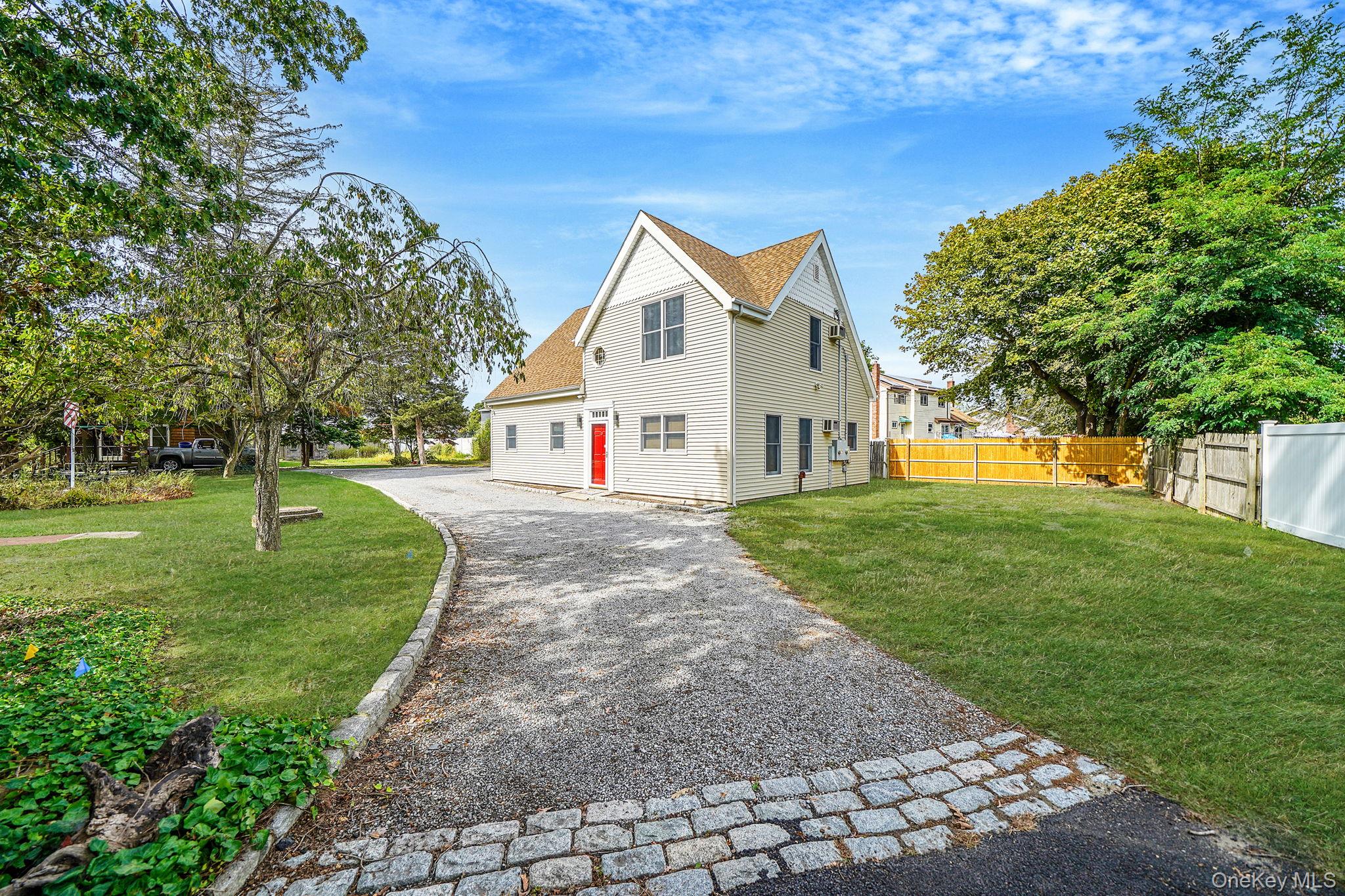 26 Bokel Road Ronkonkoma, NY 11779 - Photo 3 of 34 a view of white house with a yard