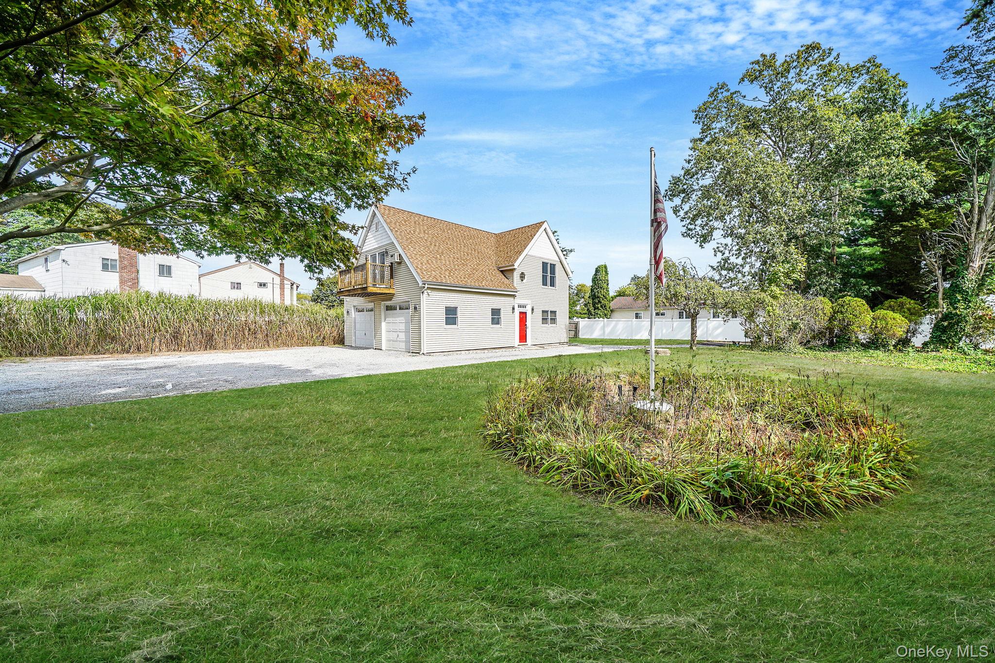 26 Bokel Road Ronkonkoma, NY 11779 - Photo 33 of 34 a view of a park with a house