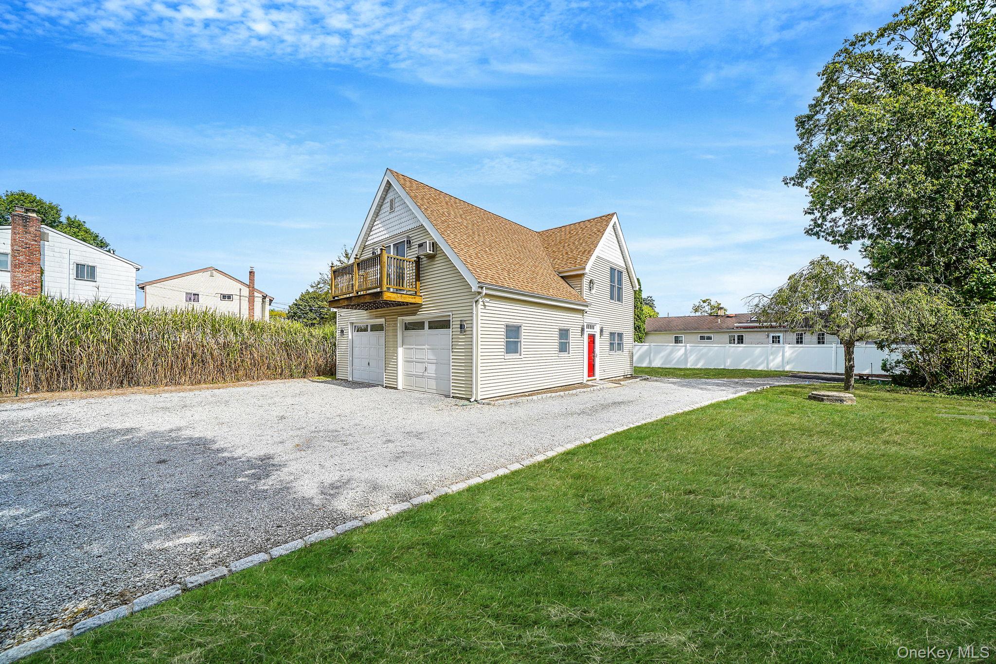 26 Bokel Road Ronkonkoma, NY 11779 - Photo 34 of 34 a view of a house with a yard