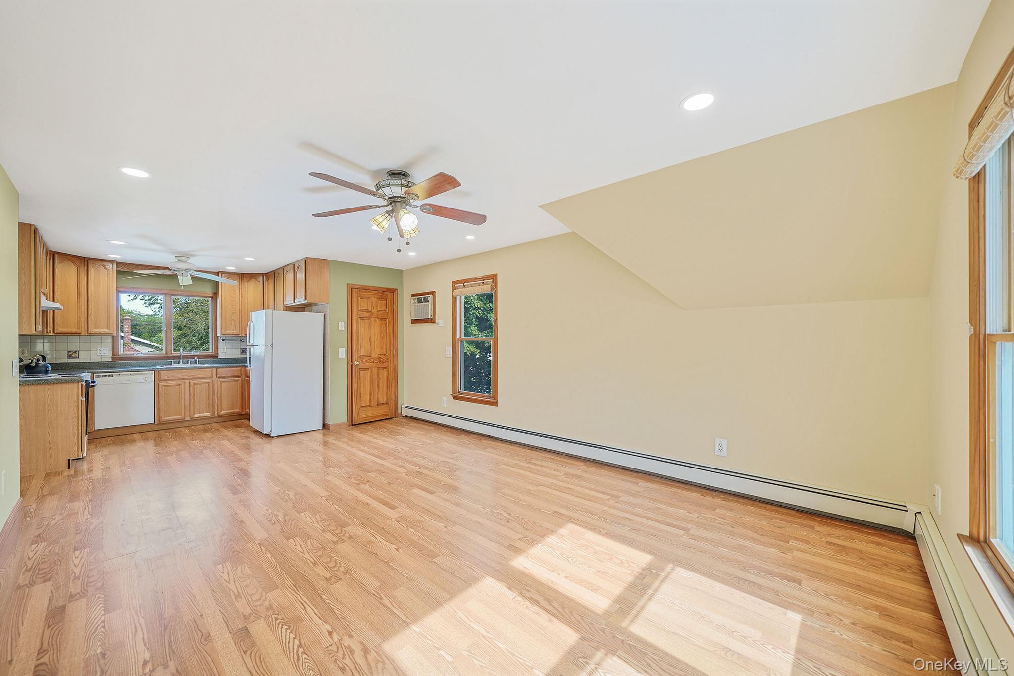 26 Bokel Road Ronkonkoma, NY 11779 - Photo 8 of 34 a view of a livingroom with a ceiling fan