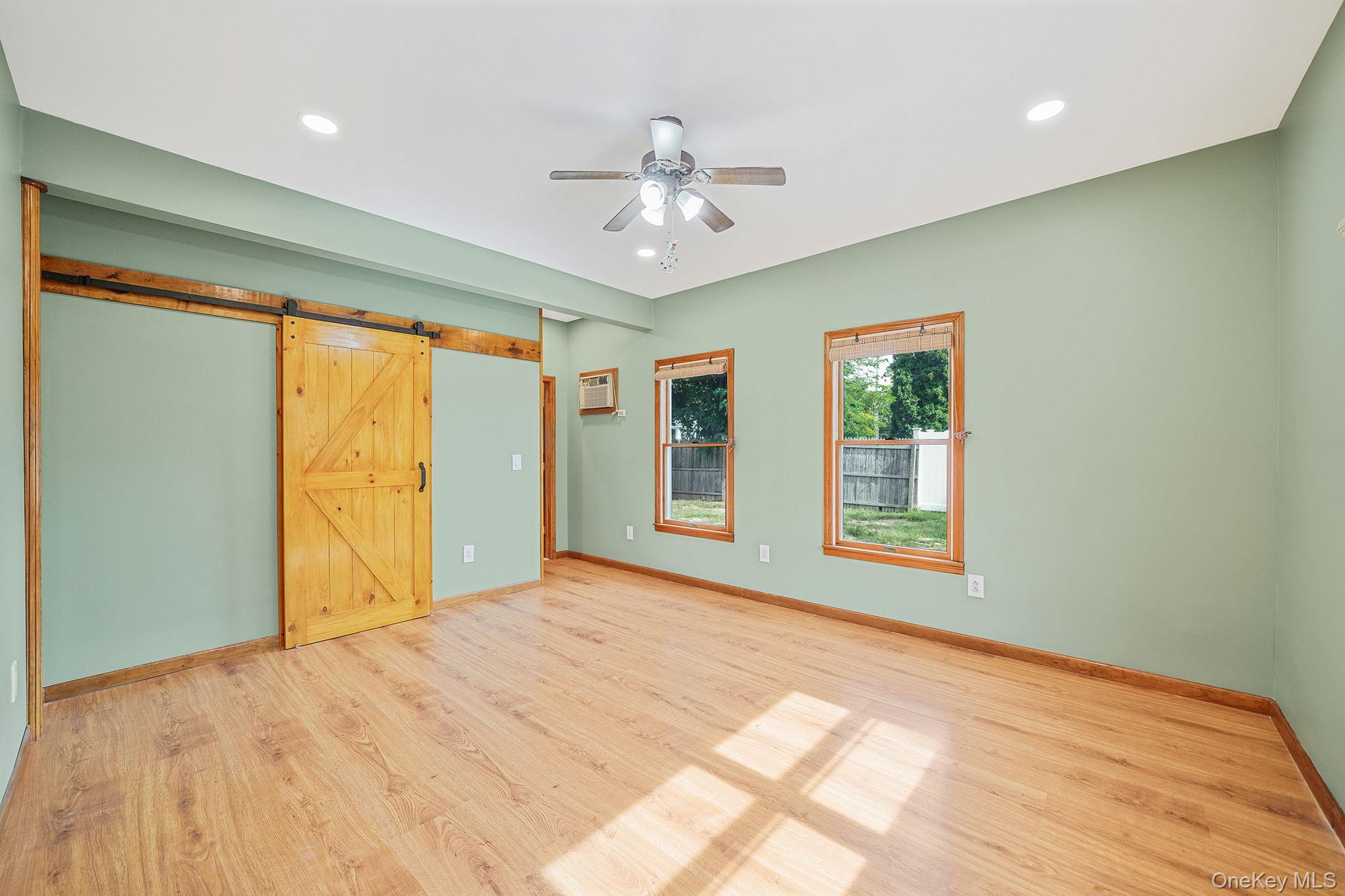 26 Bokel Road Ronkonkoma, NY 11779 - Photo 9 of 34 a view of an empty room with a window