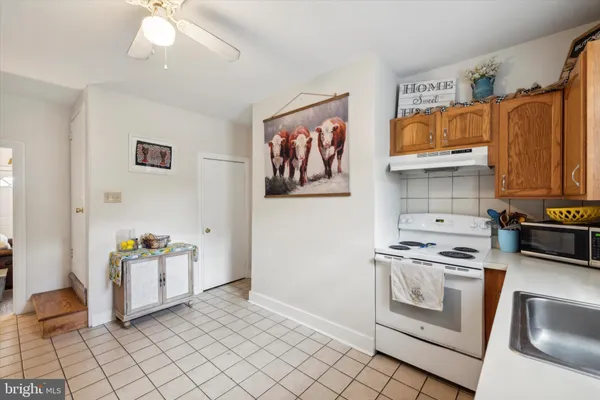 a kitchen with stainless steel appliances granite countertop a stove and a refrigerator