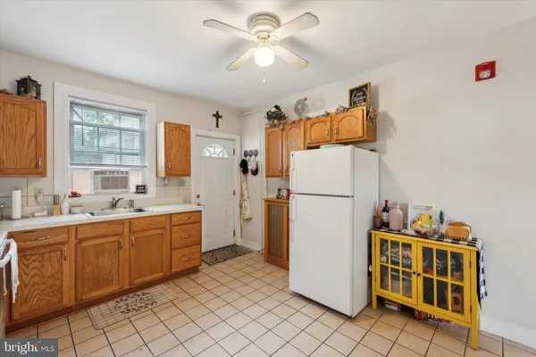 a kitchen with a refrigerator a sink and dishwasher