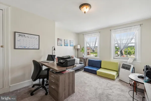 a white toilet sitting next to a bathroom sink