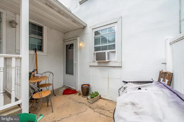a front view of a house with a garden and plants