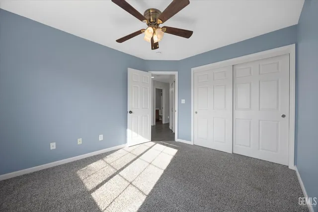 a view of storage and utility room with a wooden floor