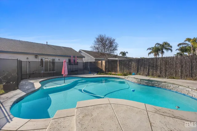 a view of a swimming pool with a sitting space