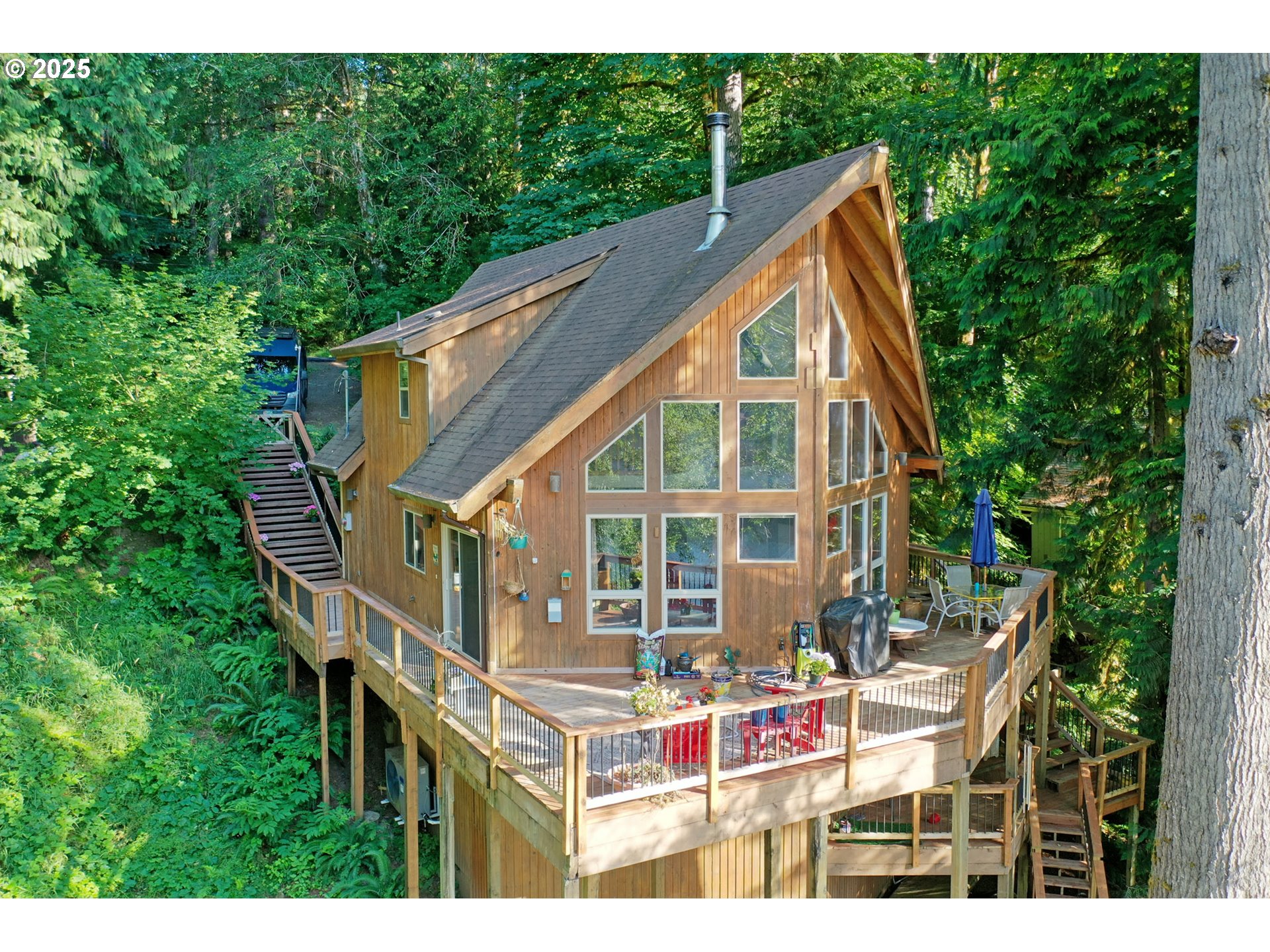 a backyard of a house with table and chairs