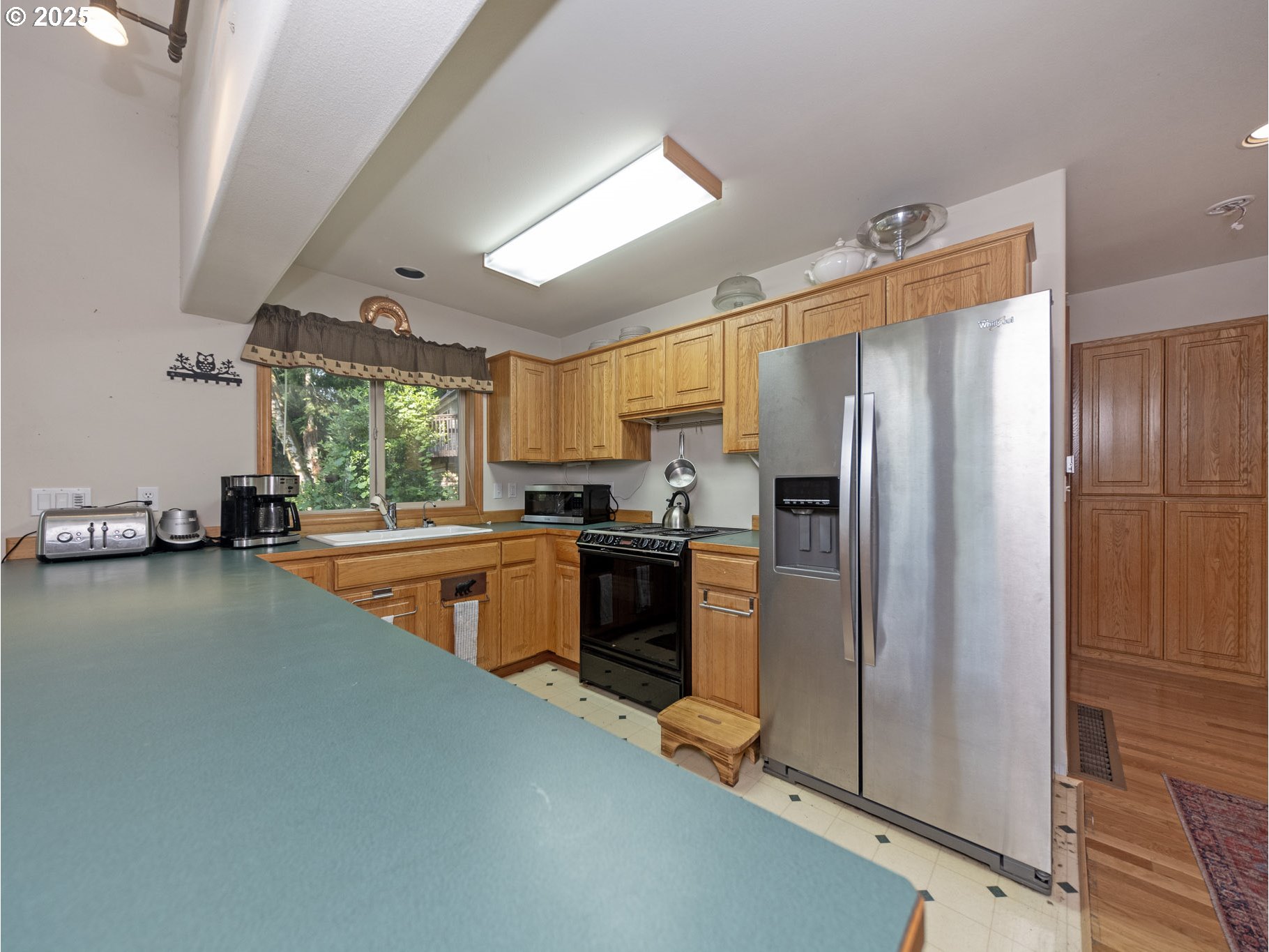 71397 Fishhawk Road Clatskanie, OR 97016 - Photo 11 of 48 a kitchen with stainless steel appliances a refrigerator sink and stove