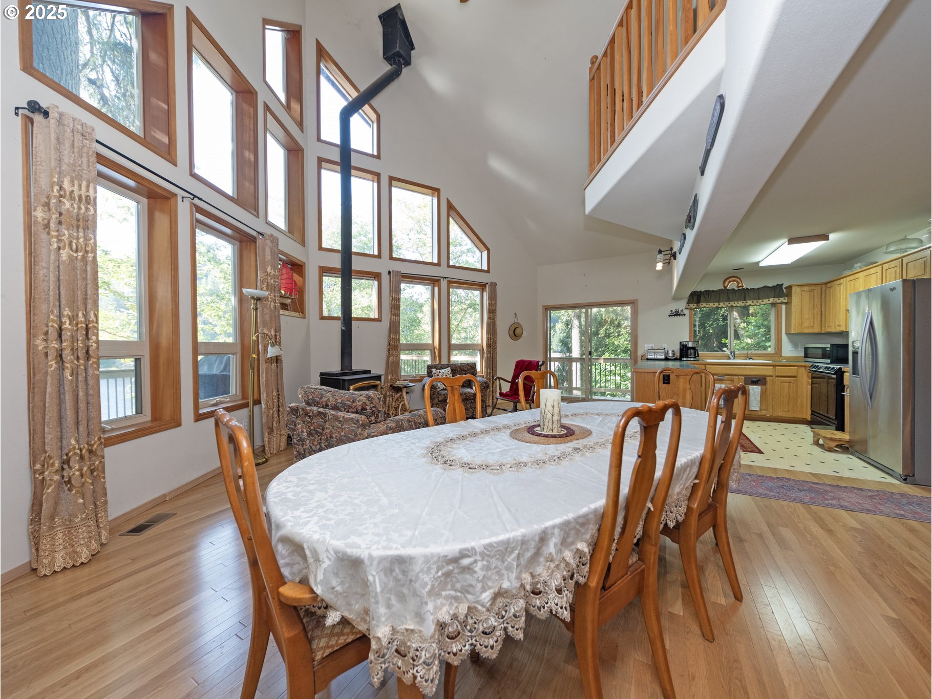 71397 Fishhawk Road Clatskanie, OR 97016 - Photo 16 of 48 a view of a dining room with furniture window and wooden floor