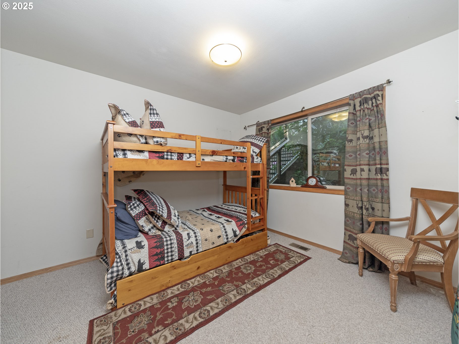 71397 Fishhawk Road Clatskanie, OR 97016 - Photo 18 of 48 a bed room with furniture and a window