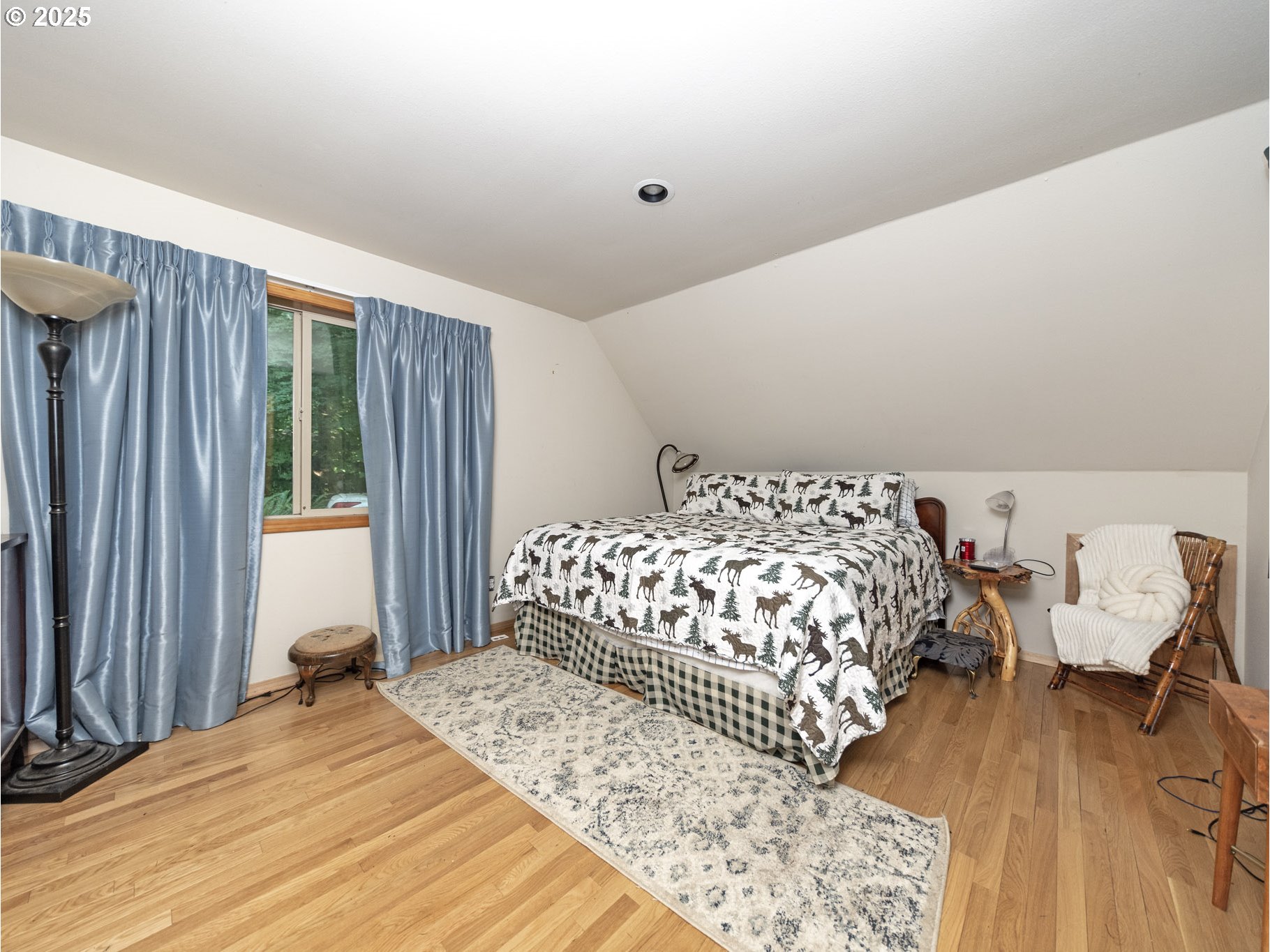 71397 Fishhawk Road Clatskanie, OR 97016 - Photo 25 of 48 a bedroom with a bed and wooden floor
