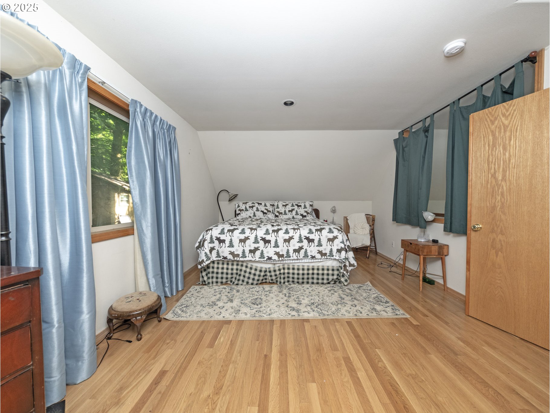 71397 Fishhawk Road Clatskanie, OR 97016 - Photo 26 of 48 a bedroom with a bed and a large window