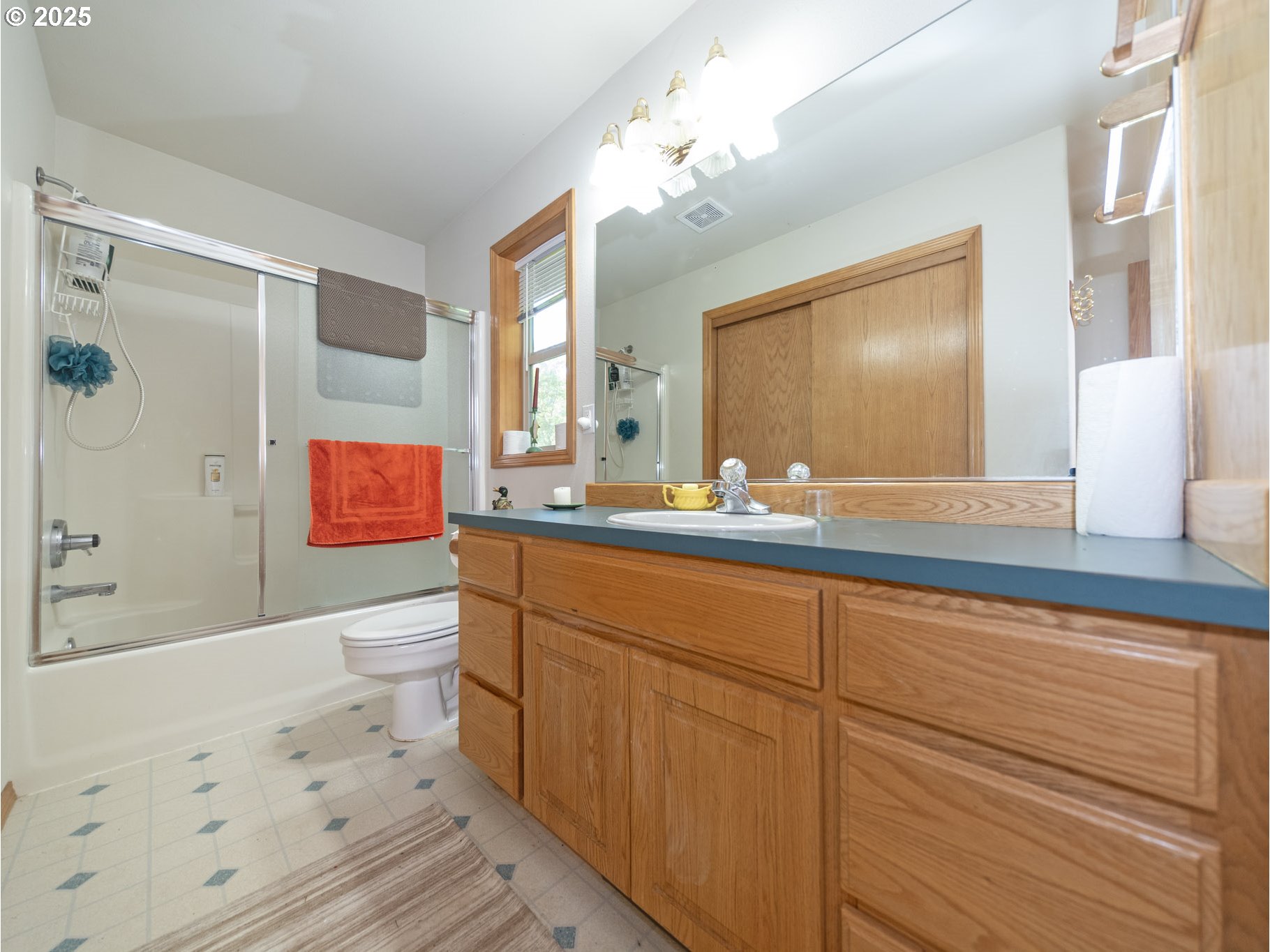 71397 Fishhawk Road Clatskanie, OR 97016 - Photo 27 of 48 a bathroom with a sink a toilet a mirror and shower