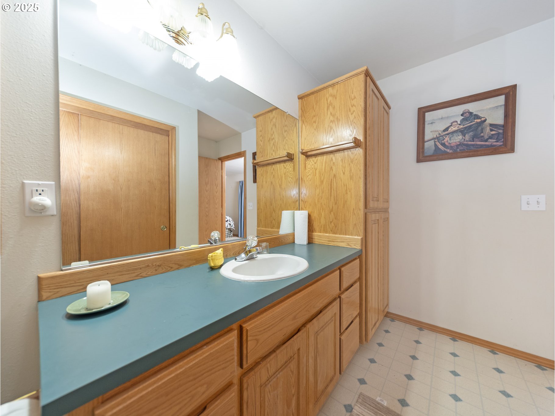 71397 Fishhawk Road Clatskanie, OR 97016 - Photo 30 of 48 a bathroom with a sink a mirror and a shower