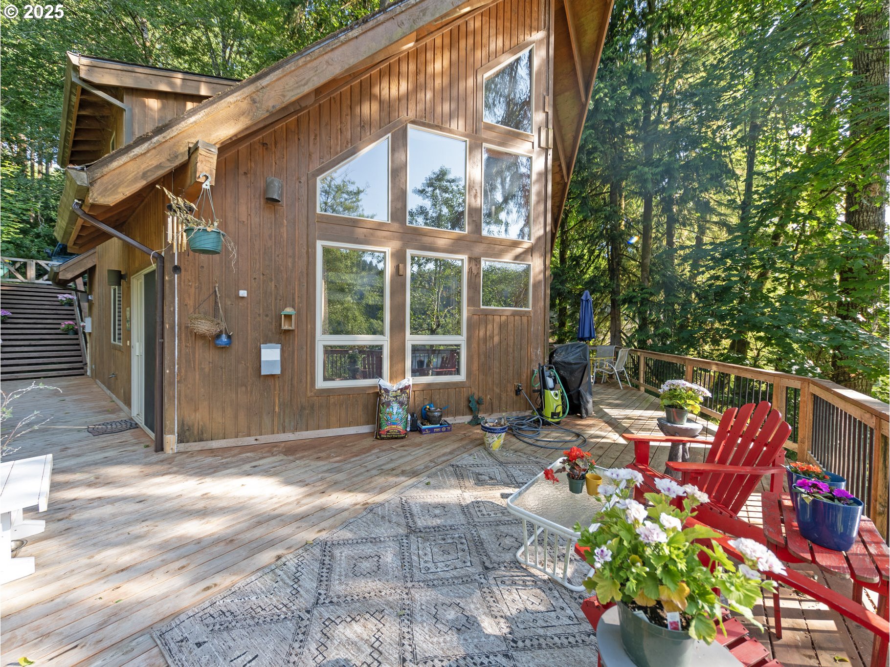 71397 Fishhawk Road Clatskanie, OR 97016 - Photo 35 of 48 a backyard of a house with outdoor seating
