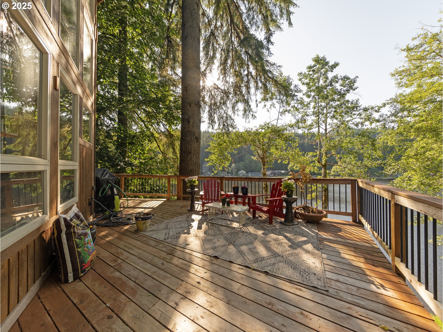 71397 Fishhawk Road Clatskanie, OR 97016 - Photo 37 of 48 a view of a balcony with chairs and wooden fence