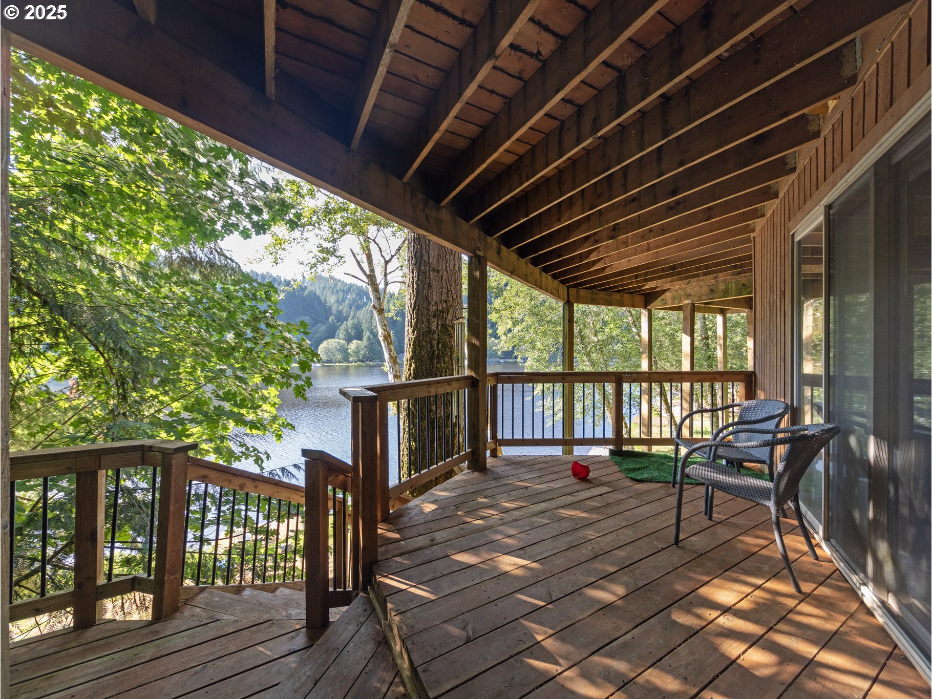 71397 Fishhawk Road Clatskanie, OR 97016 - Photo 38 of 48 a balcony with wooden floor table and chairs