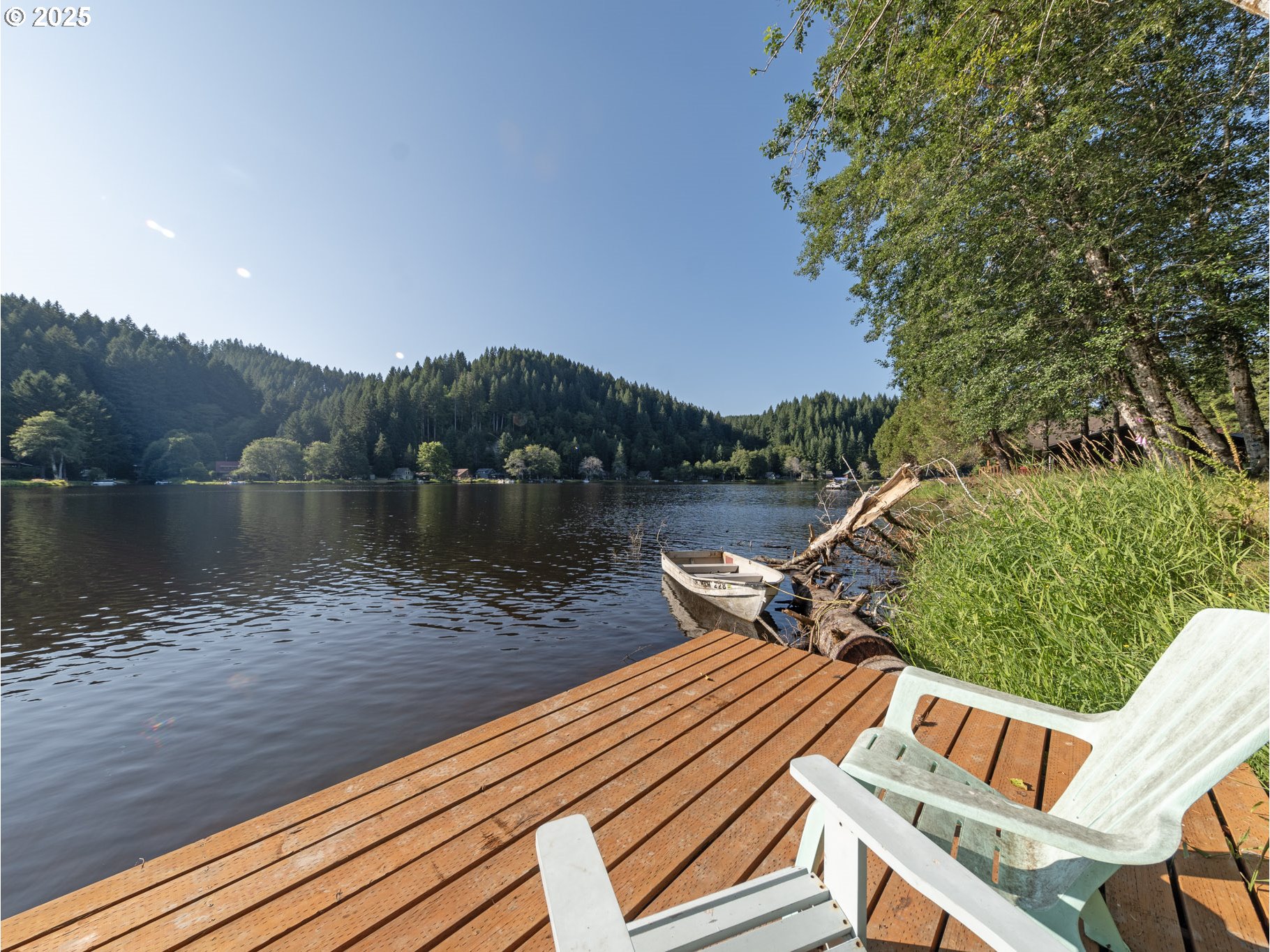 71397 Fishhawk Road Clatskanie, OR 97016 - Photo 40 of 48 a view of a lake with wooden stairs and lake view