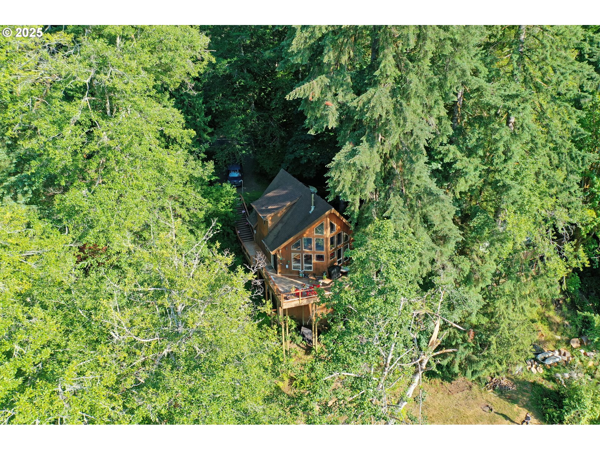 71397 Fishhawk Road Clatskanie, OR 97016 - Photo 5 of 48 a aerial view of a house with a yard