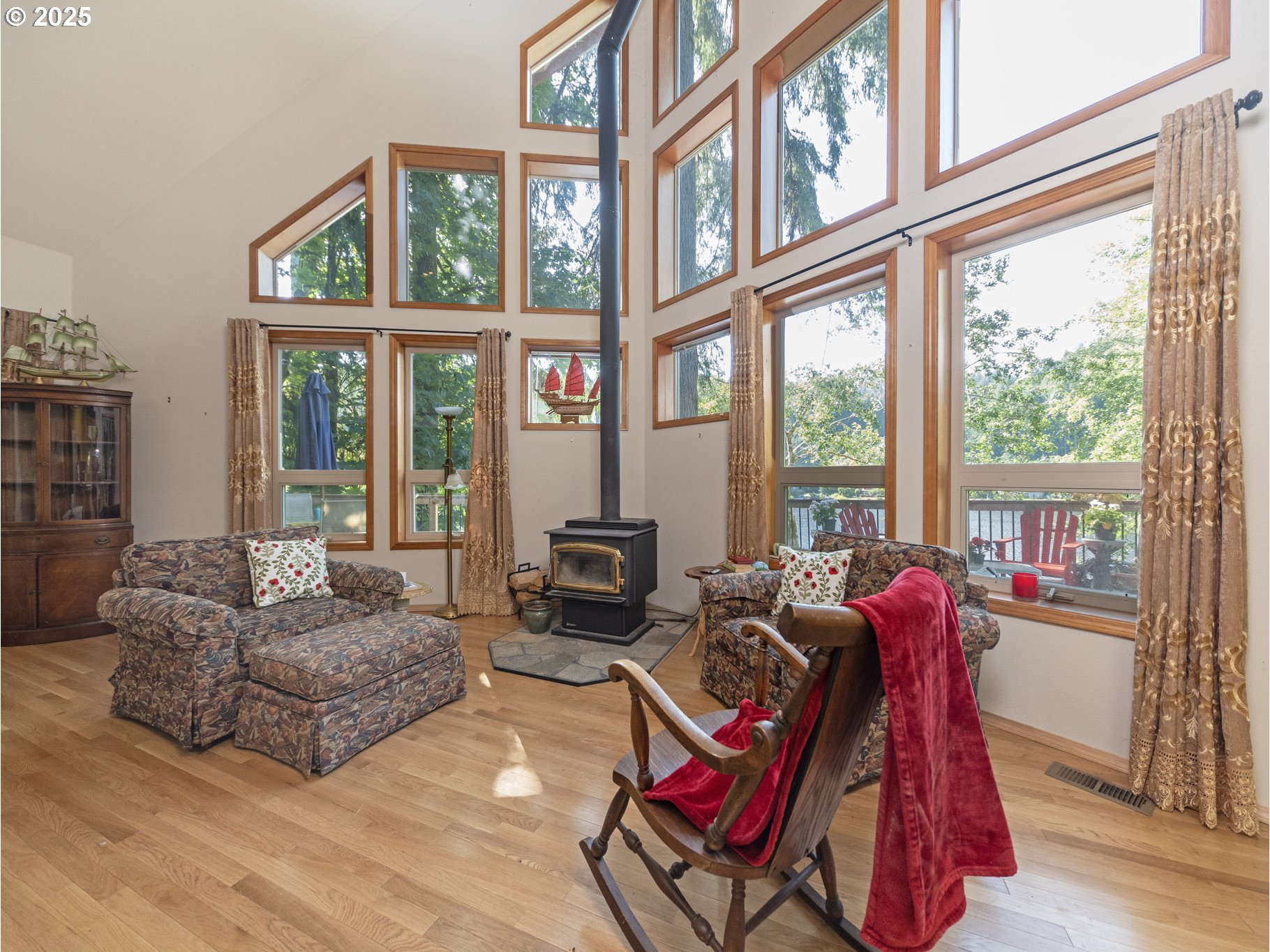 71397 Fishhawk Road Clatskanie, OR 97016 - Photo 7 of 48 a living room with furniture and floor to ceiling windows