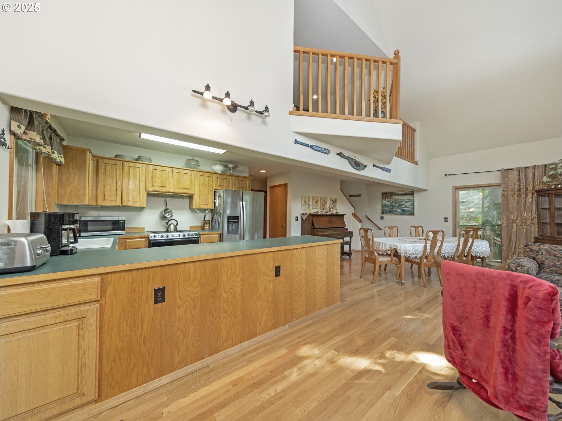 71397 Fishhawk Road Clatskanie, OR 97016 - Photo 10 of 48 a living room with furniture a dining table and chairs with wooden floor