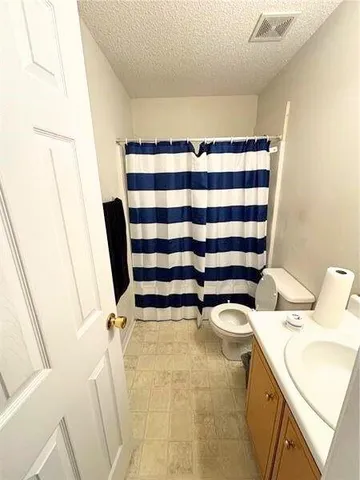 a bathroom with a sink and toilet