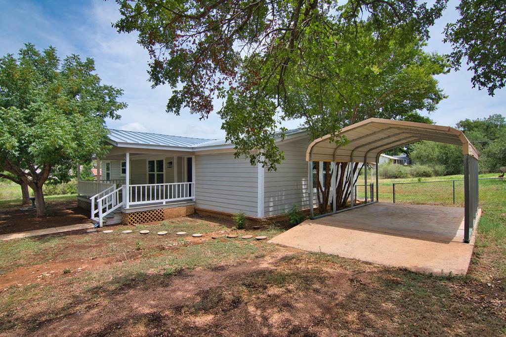 425 Post Hill Street Mason, TX 76856 - Photo 20 of 21 a view of a house with a yard tree and a yard