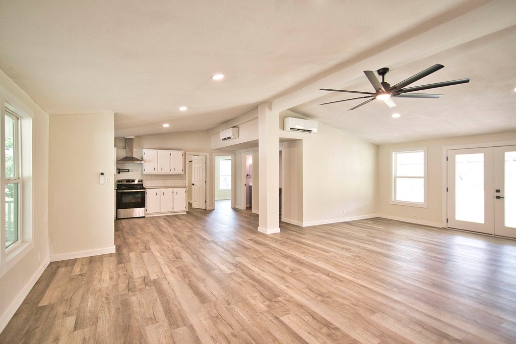 425 Post Hill Street Mason, TX 76856 - Photo 2 of 21 a view of an empty room with window and wooden floor