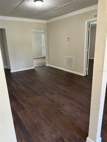 a view of a livingroom with wooden floor