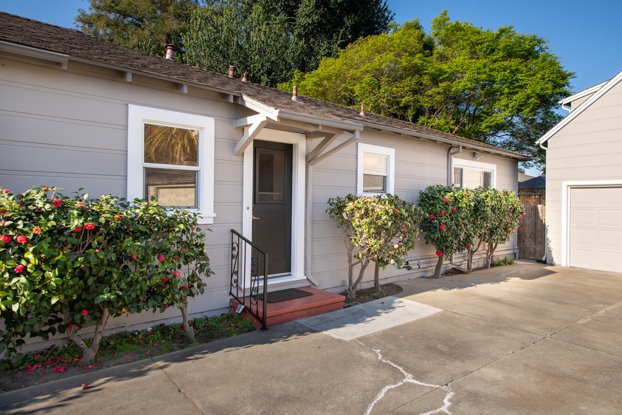 8 Oak Court Sunnyvale, CA 94086 - Photo 20 of 30 a view of a house with potted plants and a large tree