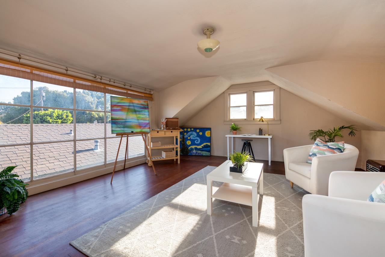 8 Oak Court Sunnyvale, CA 94086 - Photo 22 of 30 a living room with furniture and a floor to ceiling window