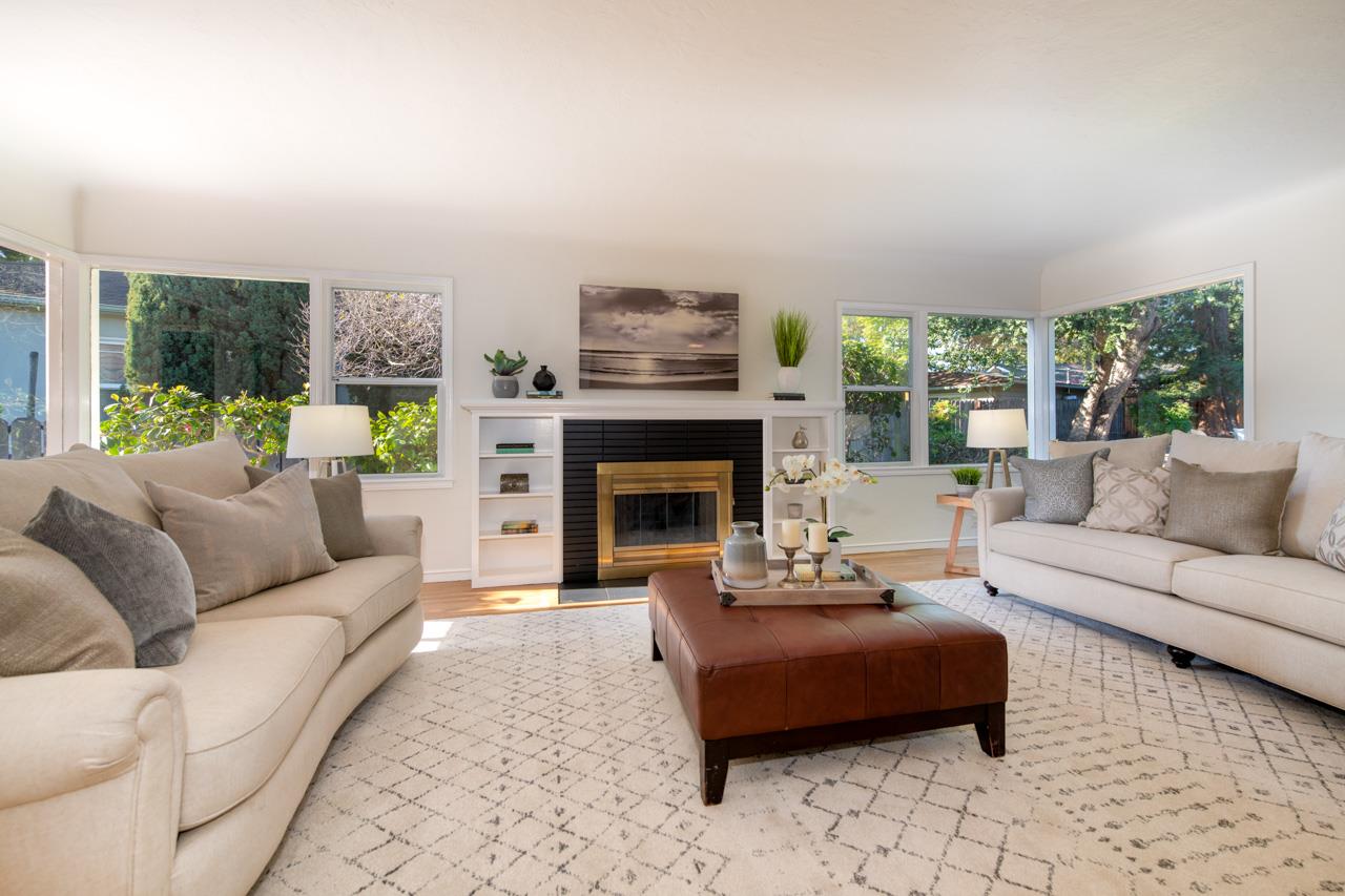 8 Oak Court Sunnyvale, CA 94086 - Photo 6 of 30 a living room with furniture and a fireplace
