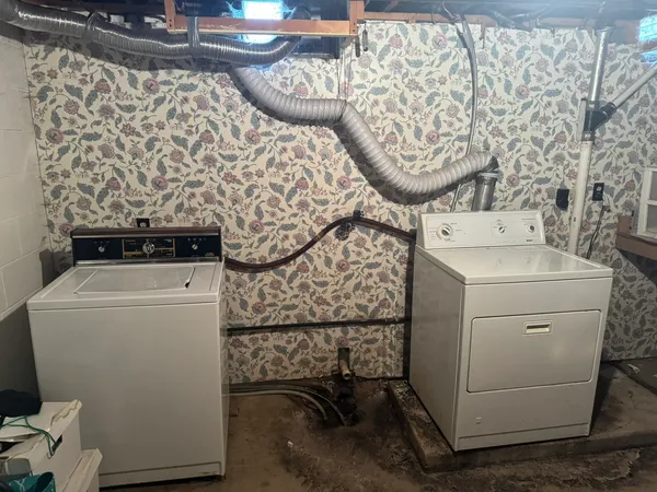 a utility room with dryer and washer