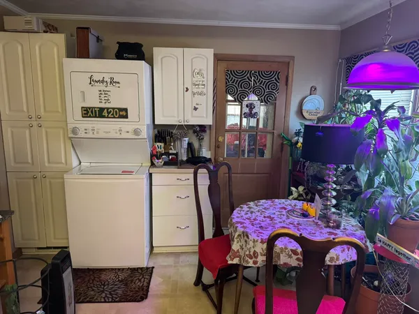 a view of living room with furniture and flowers