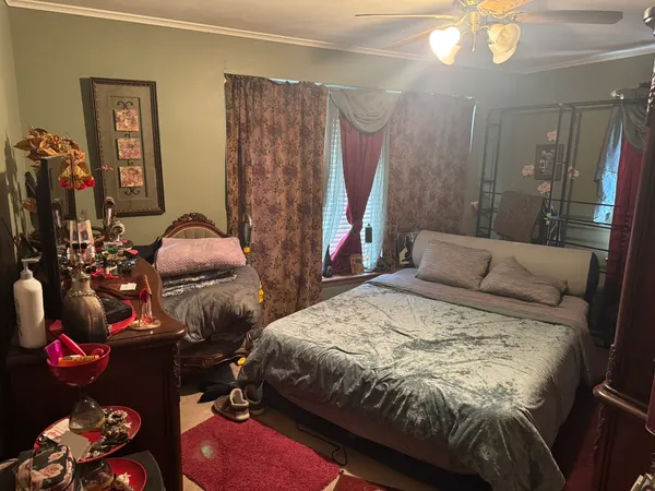 a bedroom with a bed and a mirror