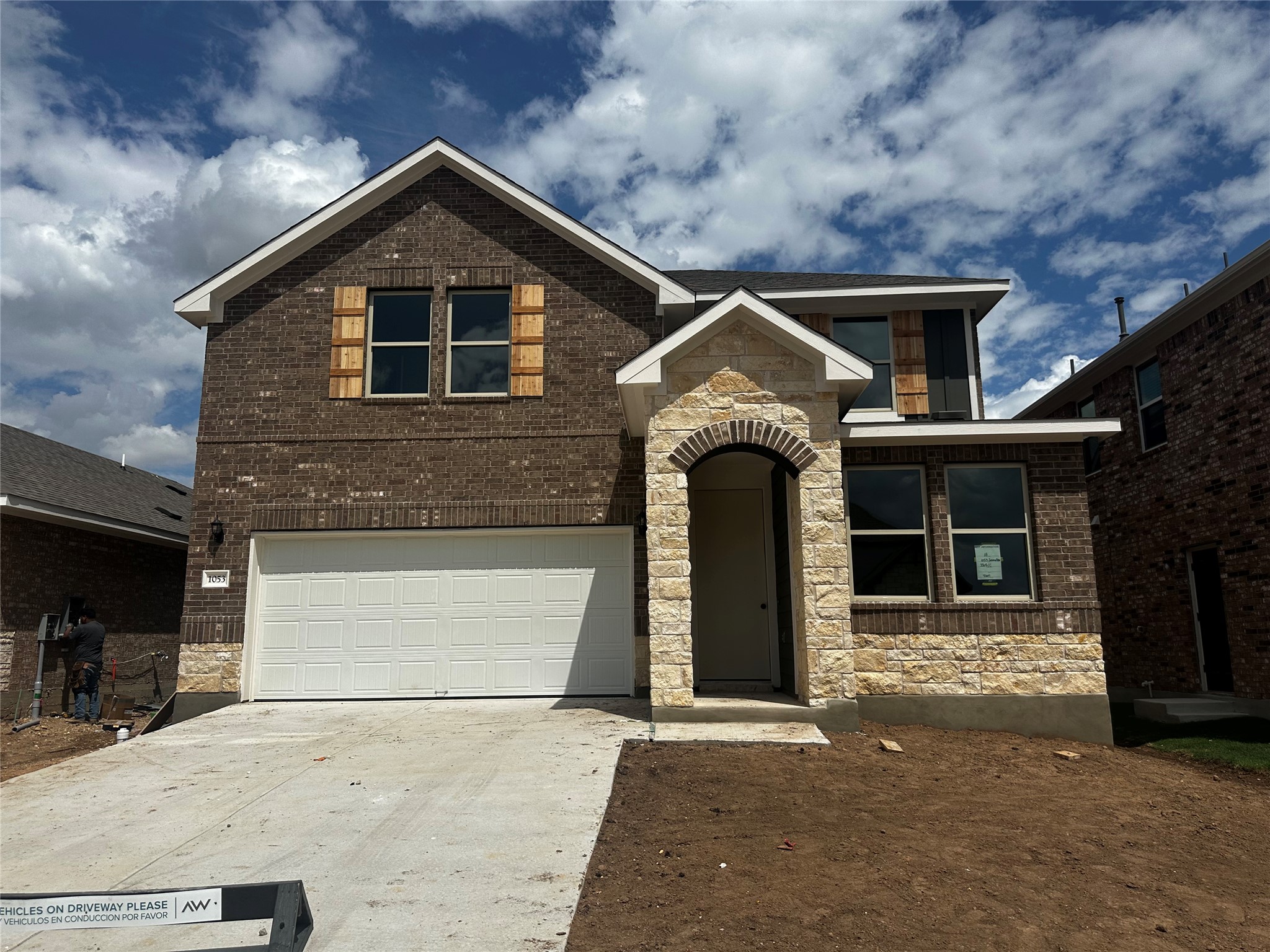 1053 Sienna Bear Road Georgetown, TX 78633 - Photo 1 of 32 a front view of a house with garage