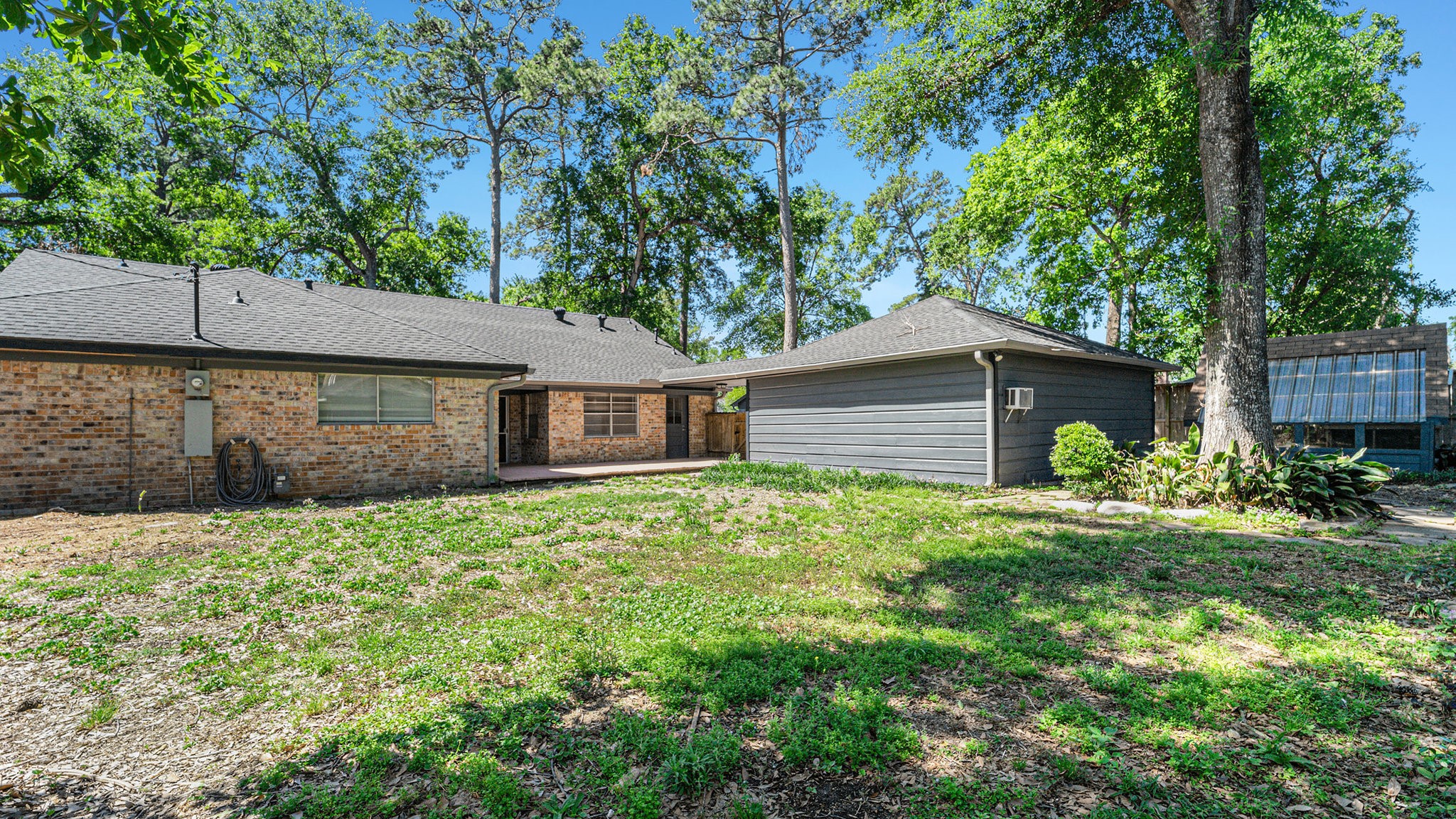 1003 Pear Tree Lane Houston, TX 77073 - Photo 15 of 15 a front view of a house with a yard and trees