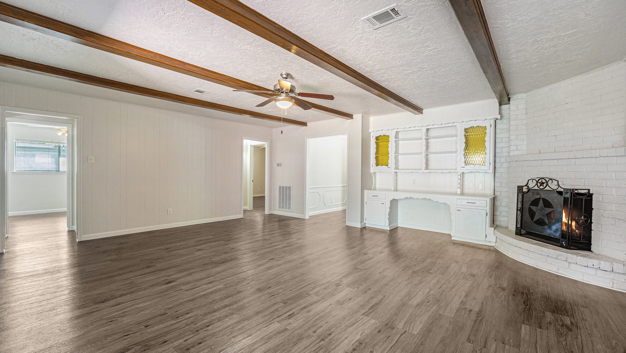 1003 Pear Tree Lane Houston, TX 77073 - Photo 3 of 15 a view of a livingroom with wooden floor and a ceiling fan