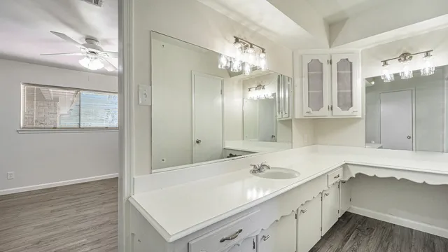 a bathroom with a sink double vanity and a mirror